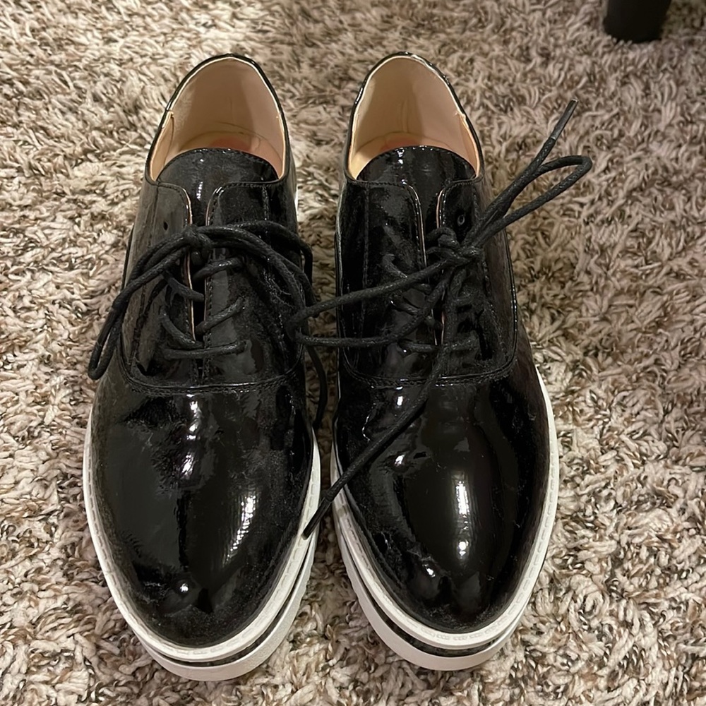 Black metallic Madden Girl platform sneaker. Size 7.5 and never worn!